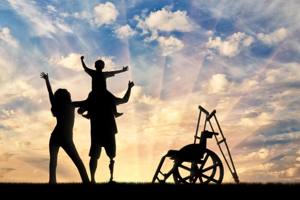 Disabled person with prosthesis and his family